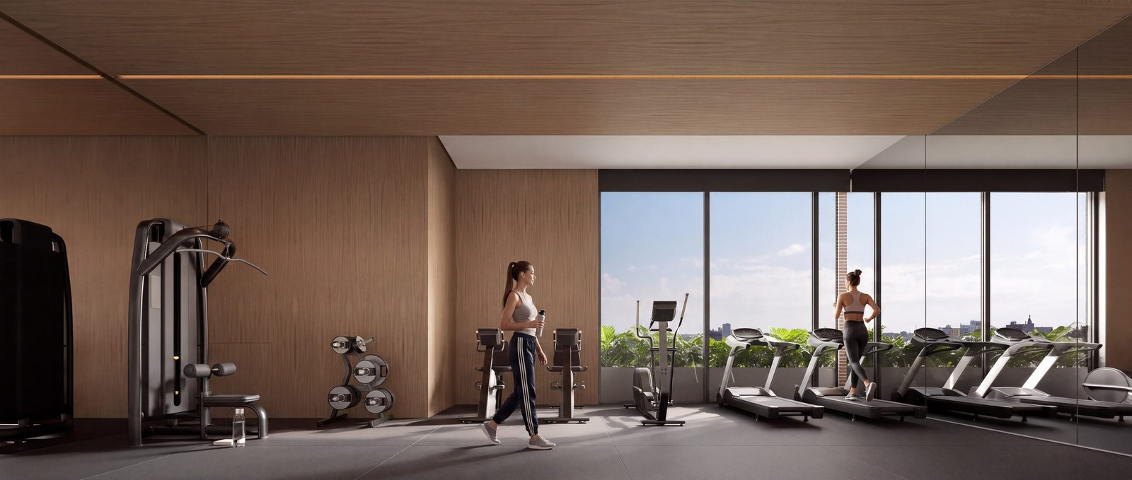 Espaço fitness com esteiras e vista